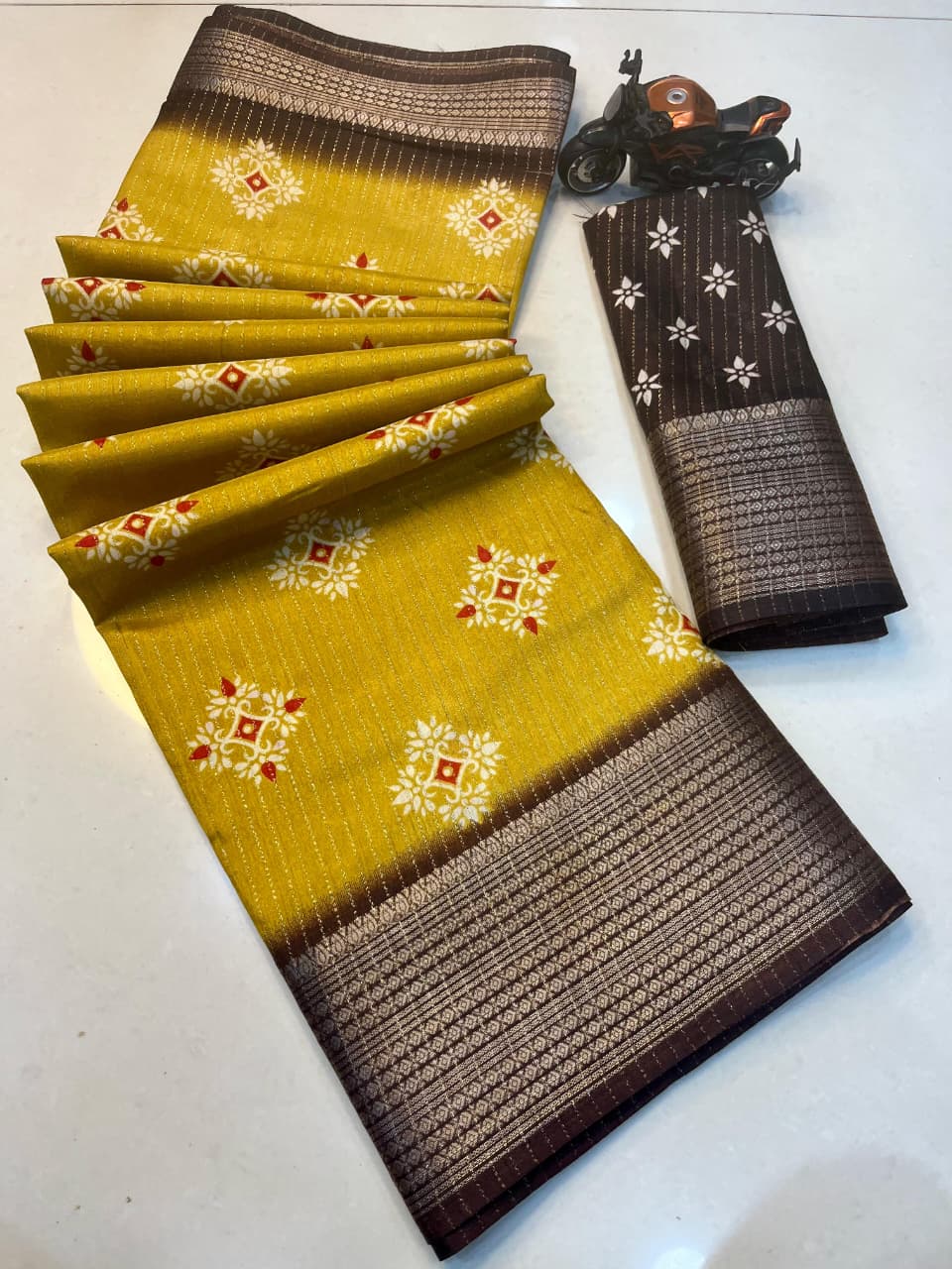 RIKO Heavy Zari Saree with Discharge Print, Zari Weave Stripes & Tassel Pallu – Premium Ethnic Elegance for Boutique Displays