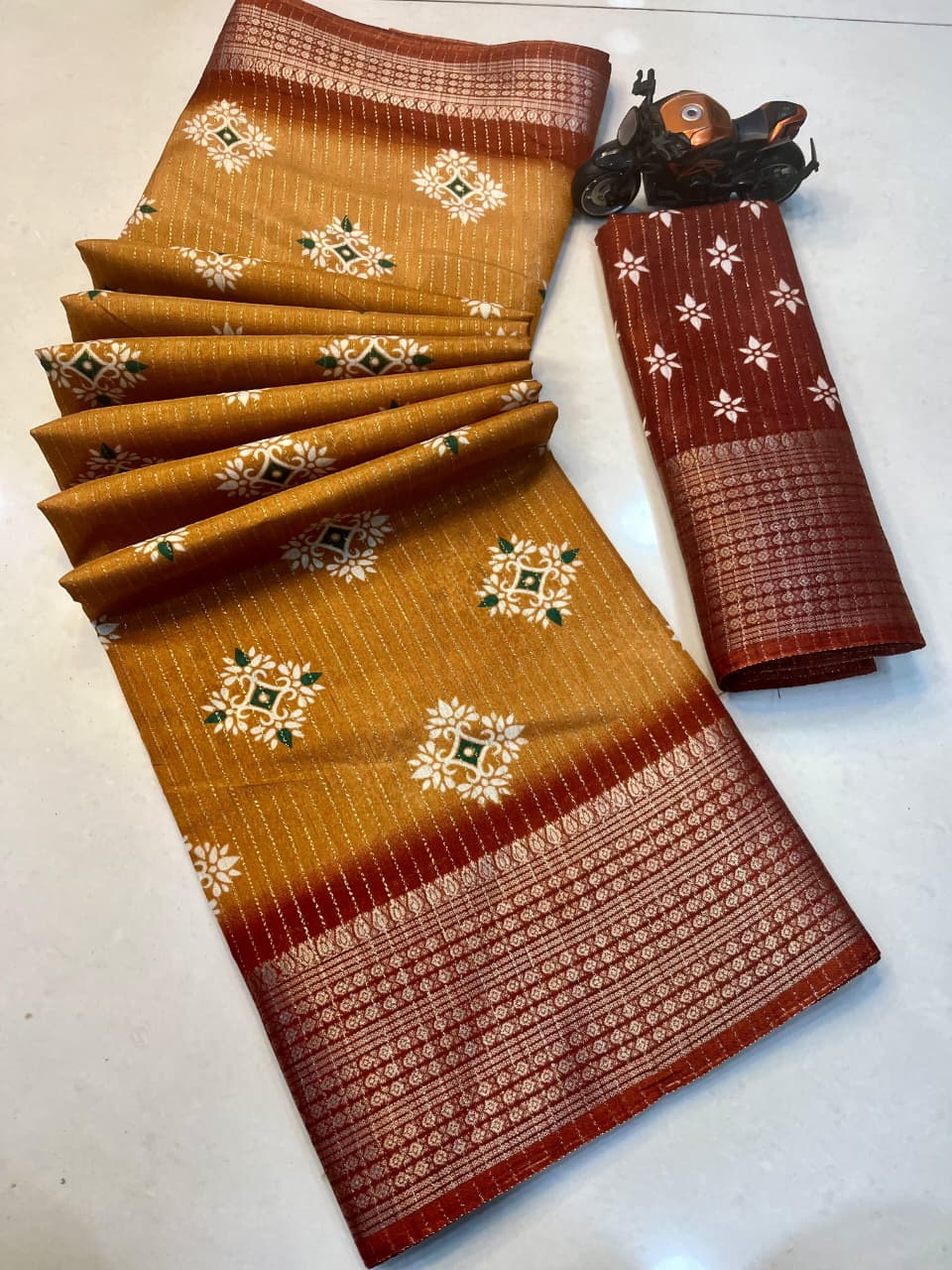 RIKO Heavy Zari Saree with Discharge Print, Zari Weave Stripes & Tassel Pallu – Premium Ethnic Elegance for Boutique Displays