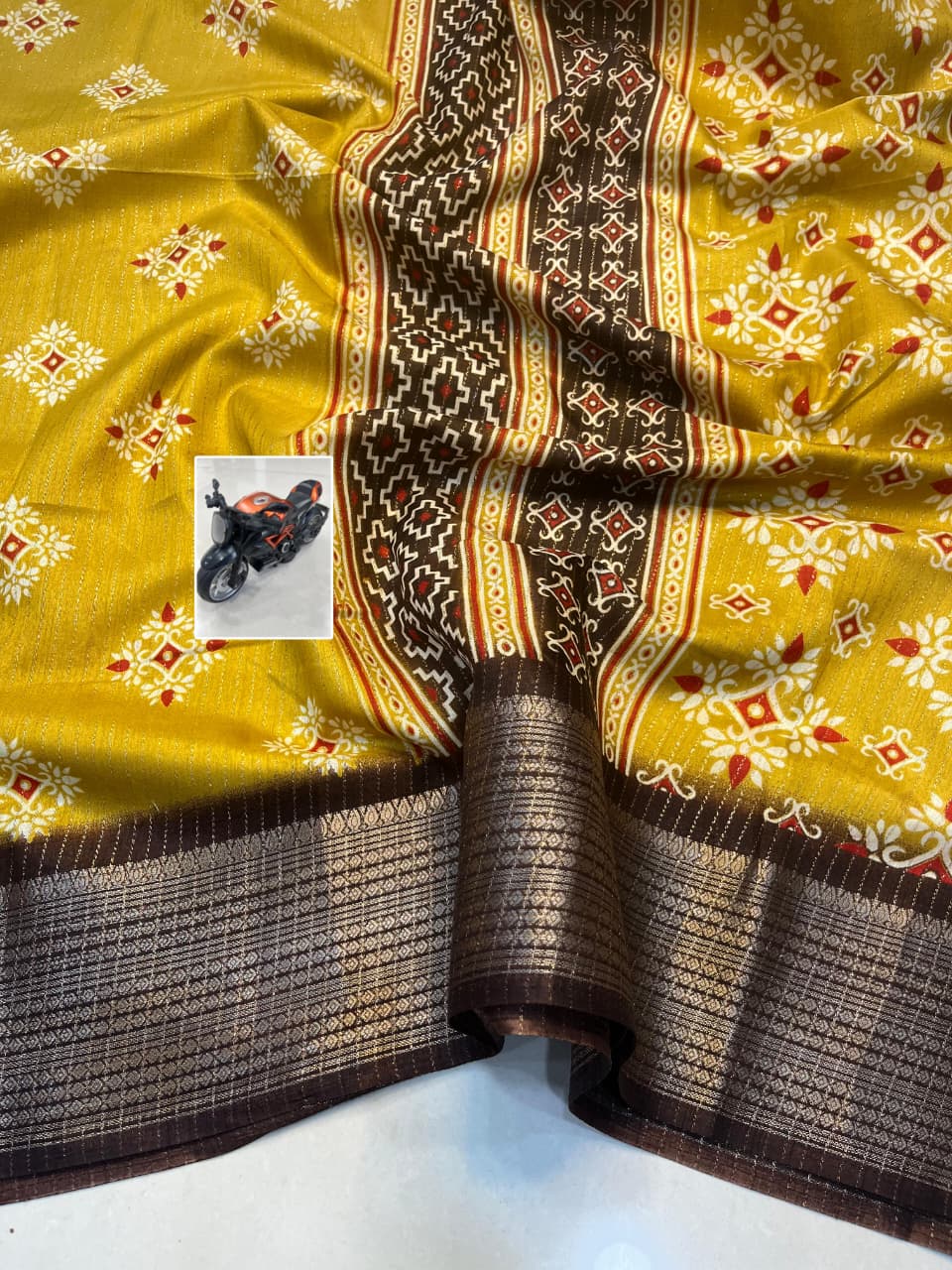 RIKO Heavy Zari Saree with Discharge Print, Zari Weave Stripes & Tassel Pallu – Premium Ethnic Elegance for Boutique Displays