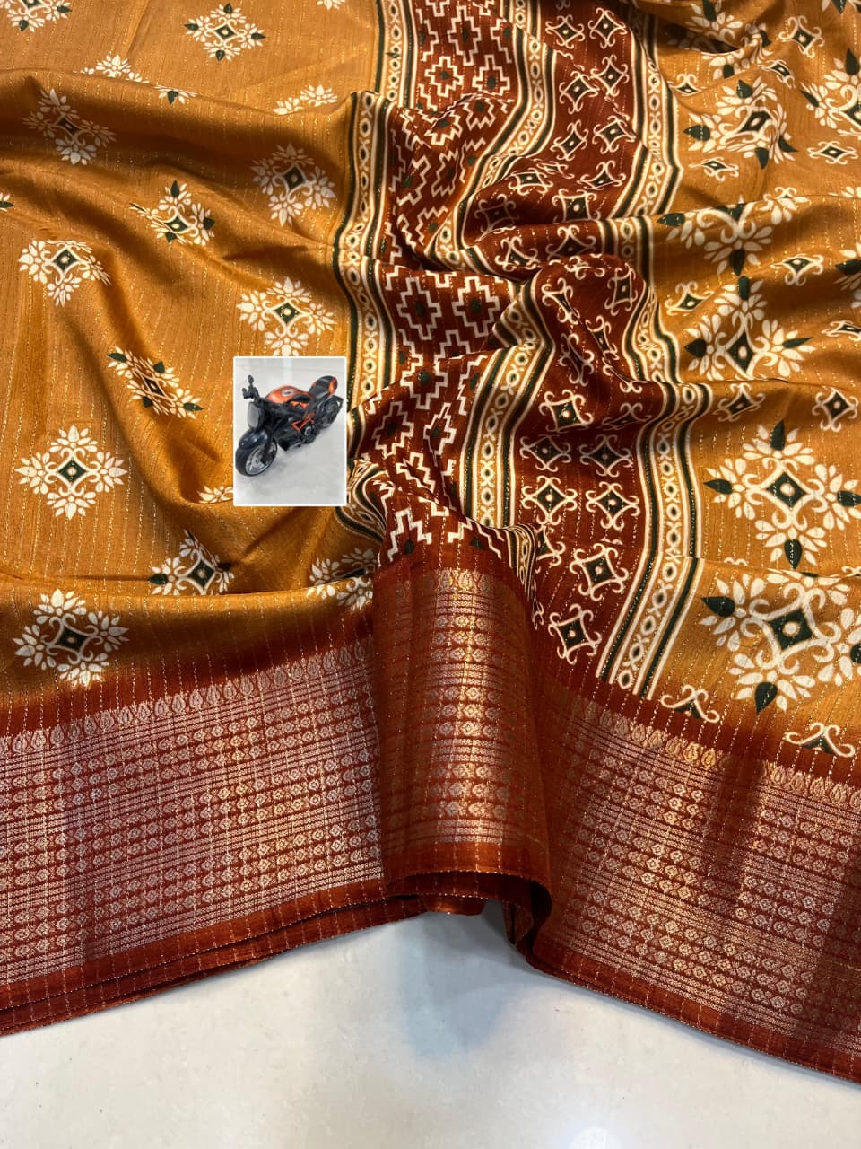 RIKO Heavy Zari Saree with Discharge Print, Zari Weave Stripes & Tassel Pallu – Premium Ethnic Elegance for Boutique Displays