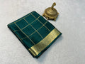 Pure Mysore Crepe Silk Saree with Zari & Elegant Blouse in deep green with gold checkered design and ornate zari border, displayed next to a decorative brass incense holder.