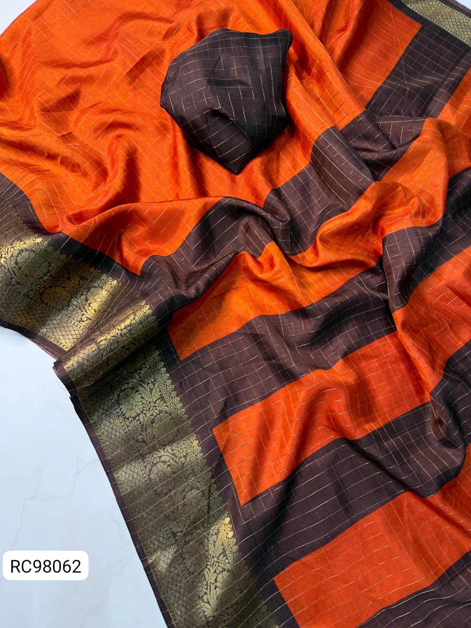 Heavy Zari Checks Saree – Rusty Orange Trend.