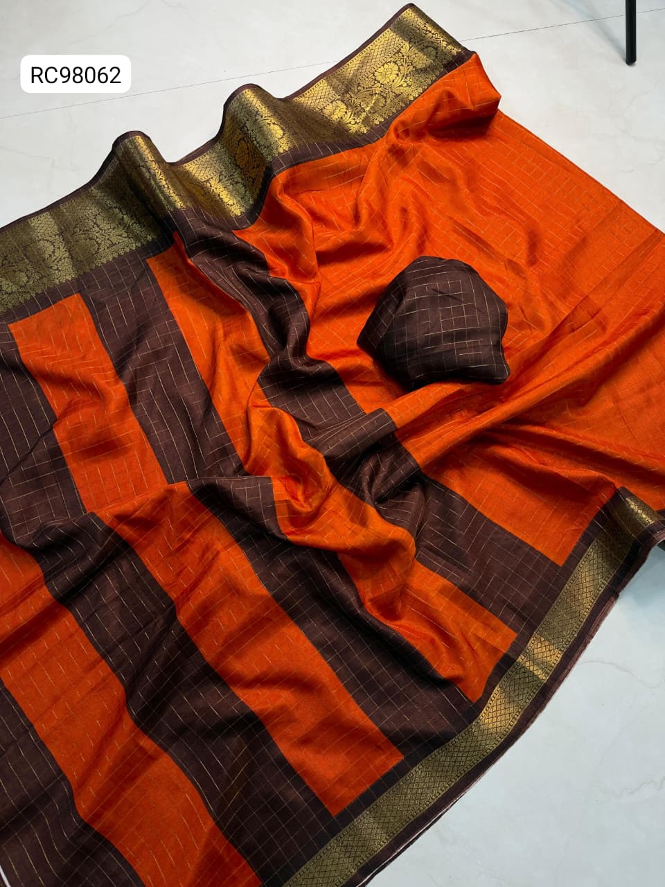 Heavy Zari Checks Saree – Rusty Orange Trend.