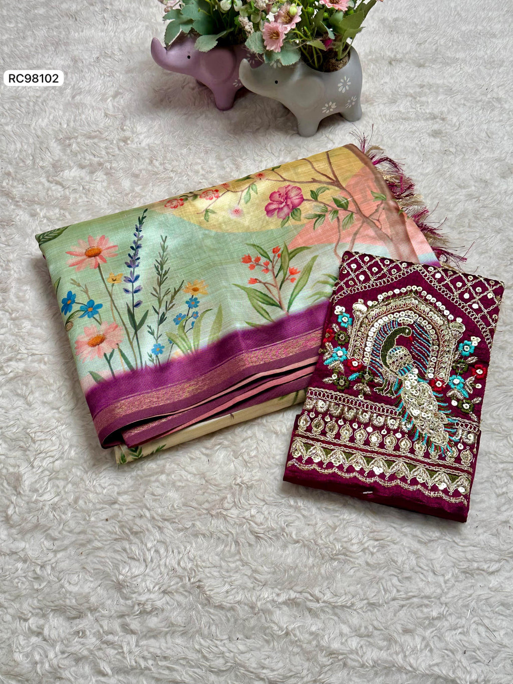 Opulent Malai Silk Saree Featuring Peacock & Floral Motifs.